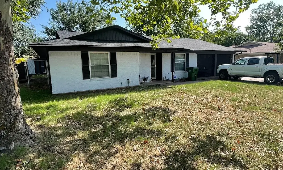 Professional roofing crew working on a residential roof in Glenarden